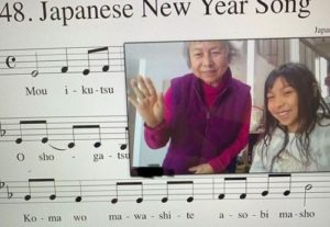 Grandma and student with Japanese New Year song.
