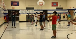 EIM students rehearsing on violins