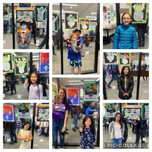 Students and Mrs. Thomas at STEAM Night showing artwork