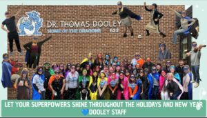 Dooley Staff in masks and capes outside the school