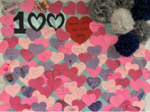 100 paper hearts with reasons why students love Dooley written on them.